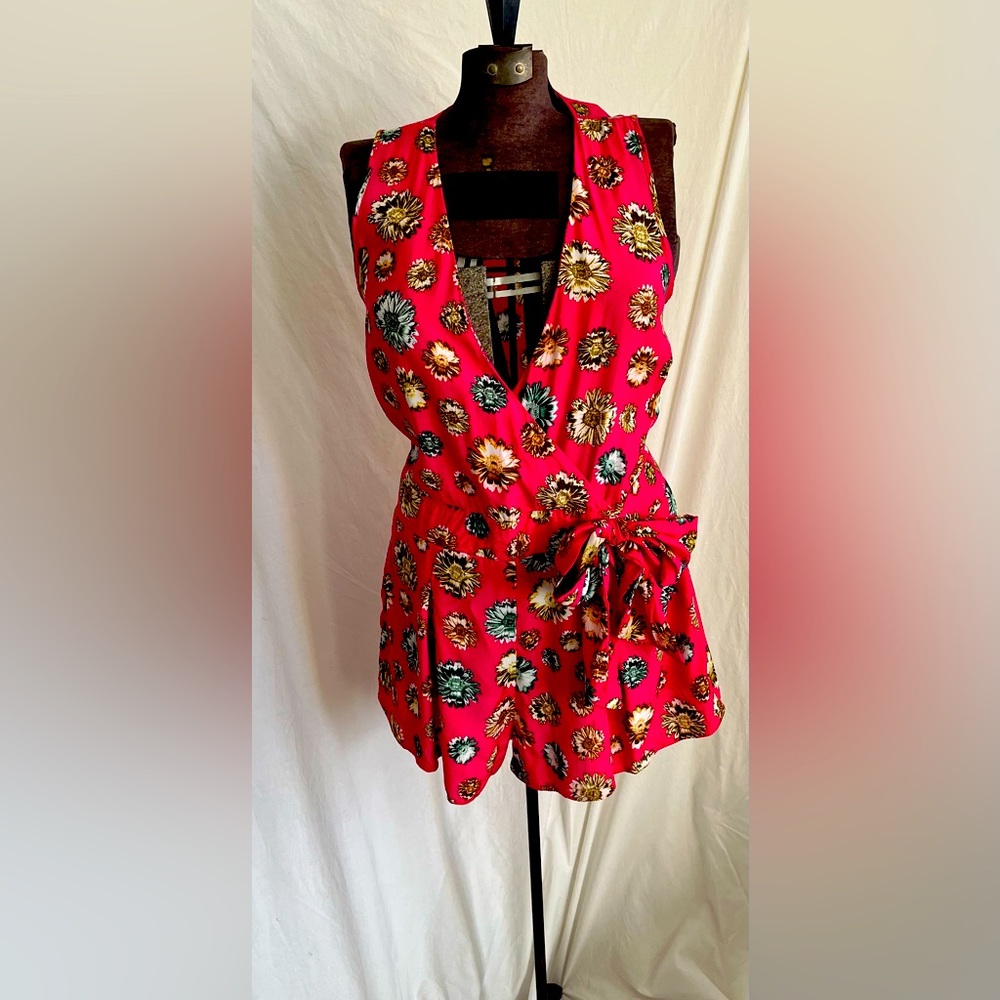 Romper hot pink with flower print on material. Size 10